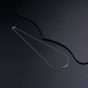 Elegant Silver Necklace Featuring a Stunning Infinity Pendant